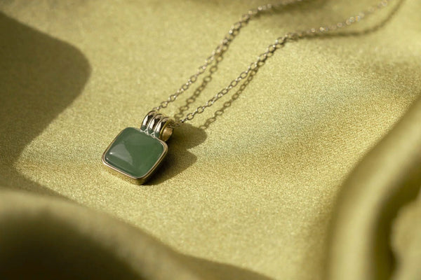 What Does a Jade Square Pendant Symbolize?