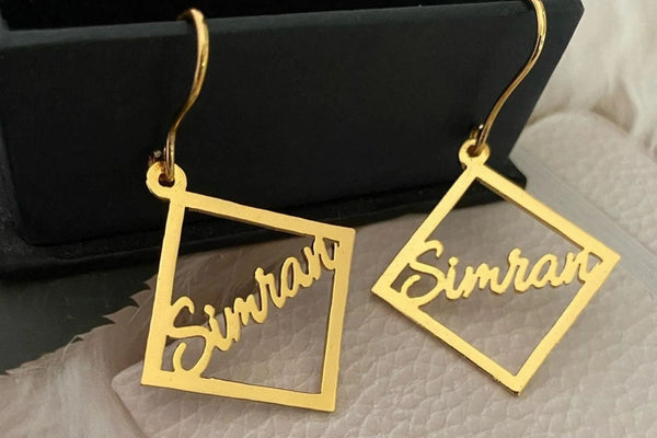 What Do Dangling Name Earrings Symbolize?